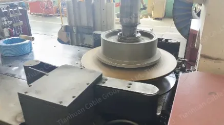 Using the automatic wire coiling and packaging machine to efficiently wrap the wires.